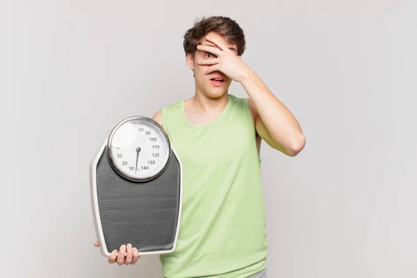 Young Boy Looking Shocked Scared Terrified Covering Face Hand Peeking — Stock Photo, Image