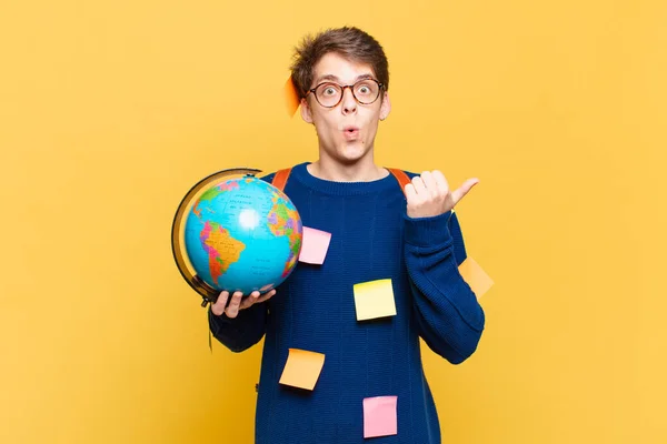 Young Student Boy Looking Astonished Disbelief Pointing Object Side Saying — Stock Photo, Image