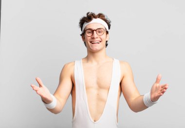 humorous sport man smiling cheerfully giving a warm, friendly, loving welcome hug, feeling happy and adorable