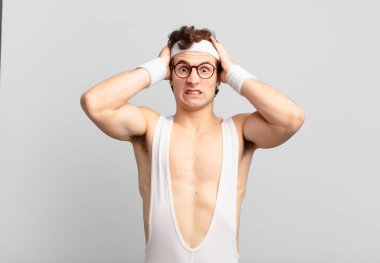 humorous sport man feeling frustrated and annoyed, sick and tired of failure, fed-up with dull, boring tasks