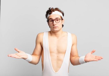 humorous sport man feeling puzzled and confused, unsure about the correct answer or decision, trying to make a choice