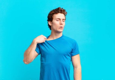 young sport boy feeling stressed, anxious, tired and frustrated, pulling shirt neck, looking frustrated with problem