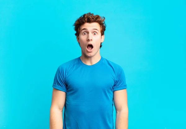 Young Sport Boy Looking Very Shocked Surprised Staring Open Mouth — Stockfoto