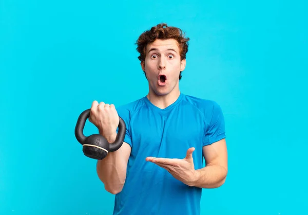 Young Sport Boy Looking Surprised Shocked Jaw Dropped Holding Object — Stock Photo, Image