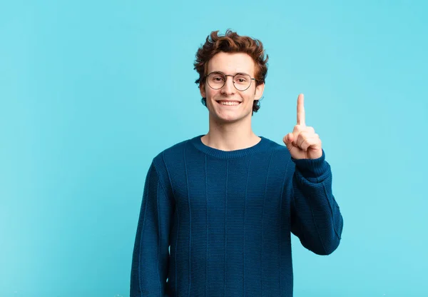 Young Handsome Boy Smiling Looking Friendly Showing Number One First — Stock Photo, Image