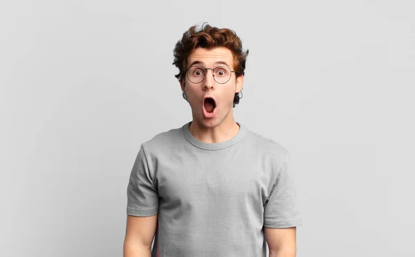 Young Handsome Boy Looking Very Shocked Surprised Staring Open Mouth — Stock Photo, Image