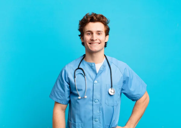 Young Nurse Man Smiling Happily Hand Hip Confident Positive Proud — Stock Photo, Image