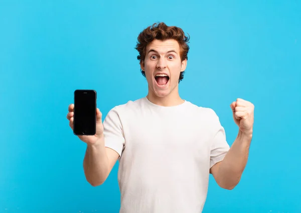 Young Boy Shouting Aggressively Angry Expression Fists Clenched Celebrating Success — Stock Photo, Image