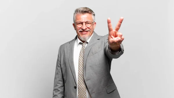 Senior Businessman Smiling Looking Happy Carefree Positive Gesturing Victory Peace — Stock Photo, Image