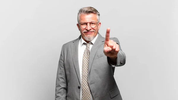 Senior Businessman Smiling Proudly Confidently Making Number One Pose Triumphantly — Stock Photo, Image