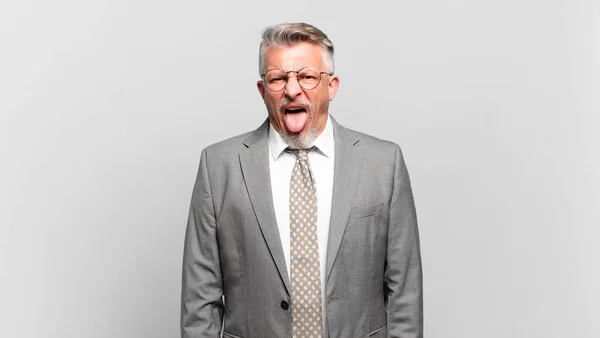 Senior Businessman Cheerful Carefree Rebellious Attitude Joking Sticking Tongue Out — Stock Photo, Image