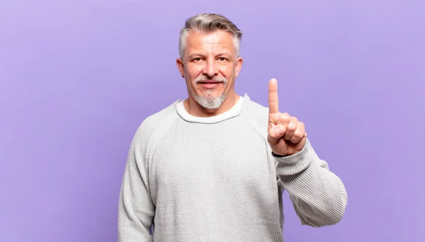 Old Senior Man Smiling Looking Friendly Showing Number One First —  Fotos de Stock