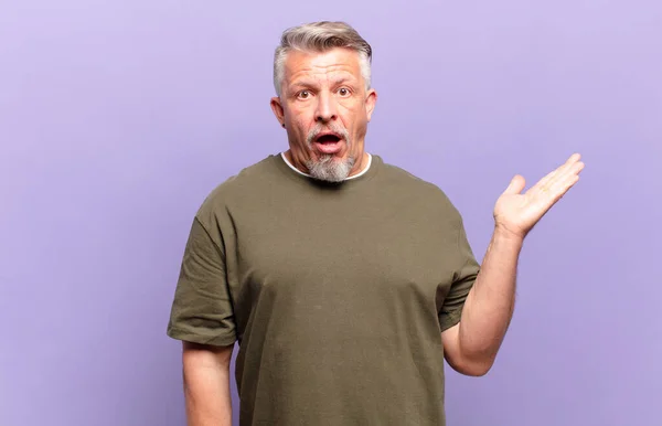 Old Senior Man Looking Surprised Shocked Jaw Dropped Holding Object — Foto de Stock