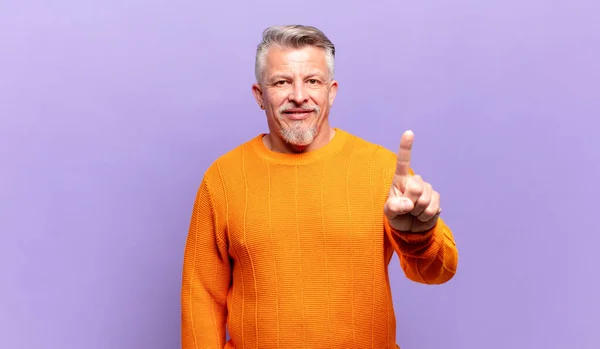 Old Senior Man Smiling Looking Friendly Showing Number One First — Foto de Stock