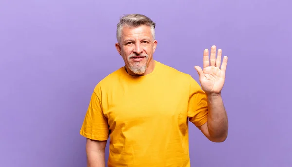 Old Senior Man Smiling Happily Cheerfully Waving Hand Welcoming Greeting — Foto de Stock