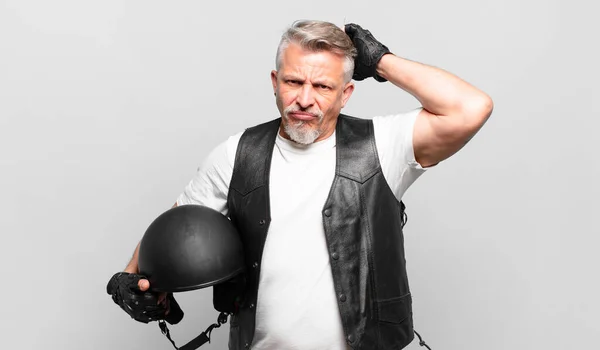 Senior Motorbike Rider Feeling Puzzled Confused Scratching Head Looking Side — Stock Photo, Image