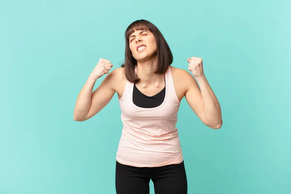 Athlete Woman Shouting Aggressively Angry Expression Fists Clenched Celebrating Success — Stok fotoğraf