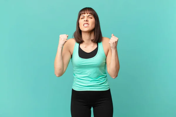 Athlete Woman Shouting Aggressively Angry Expression Fists Clenched Celebrating Success — Stok fotoğraf