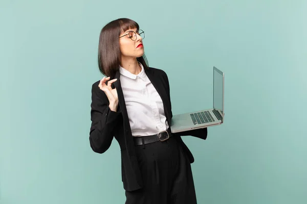 businesswoman looking arrogant, successful, positive and proud, pointing to self