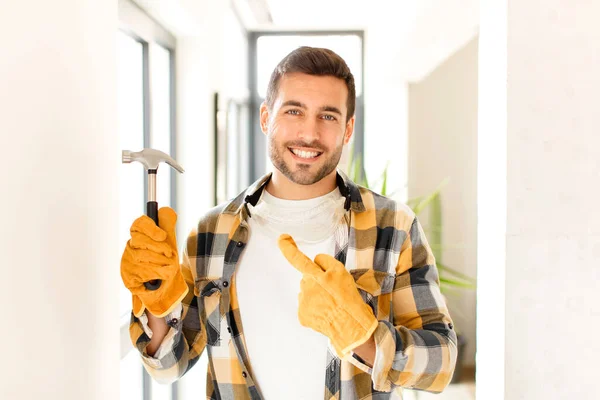 Handyman Smiling Cheerfully Feeling Happy Pointing Side Upwards Showing Object — Stock Photo, Image