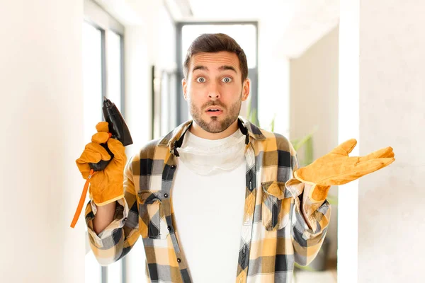 Handyman Looking Surprised Shocked Jaw Dropped Holding Object Open Hand — Stock Photo, Image