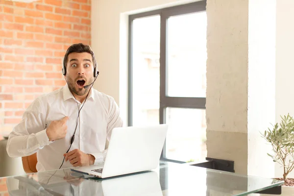 Handsome Telemarketer Looking Shocked Surprised Mouth Wide Open Pointing Self — Stock Photo, Image