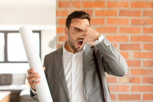 Handsome Architect Looking Shocked Scared Terrified Covering Face Hand Peeking — Stock Photo, Image