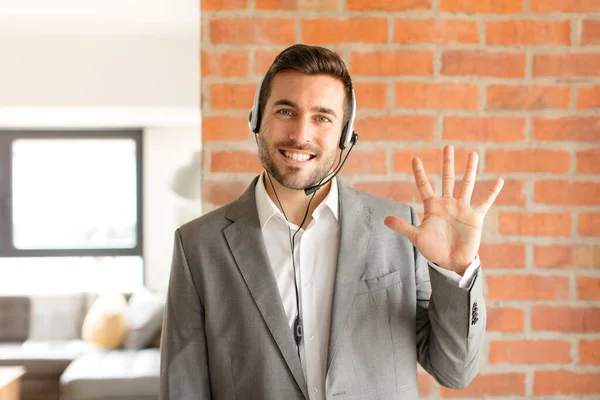 Handsome Telemarketer Smiling Looking Friendly Showing Number Five Fifth Hand — Stock Photo, Image