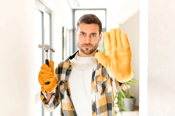 Handyman Looking Serious Stern Displeased Angry Showing Open Palm Making — Stock Photo, Image