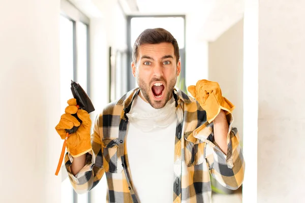 Handyman Shouting Aggressively Angry Expression Fists Clenched Celebrating Success — Stock Photo, Image