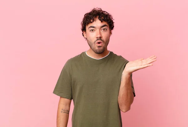 Hispanic Handsome Man Looking Surprised Shocked Jaw Dropped Holding Object — Stock Photo, Image