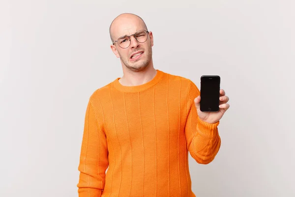 Bald Man Smartphone Feeling Puzzled Confused Dumb Stunned Expression Looking — Stock Fotó