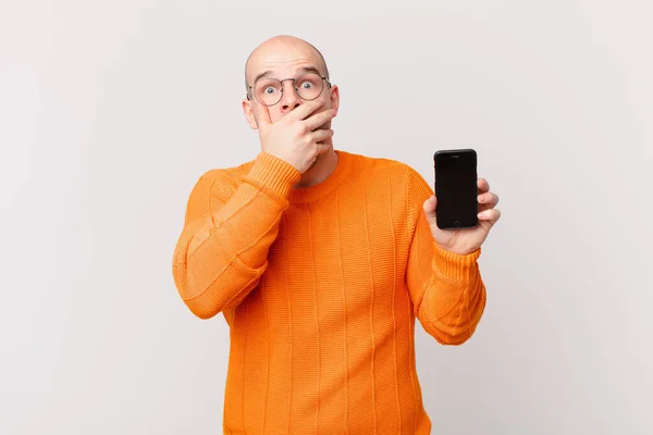 Bald Man Smartphone Covering Mouth Hands Shocked Surprised Expression Keeping — Stock Photo, Image