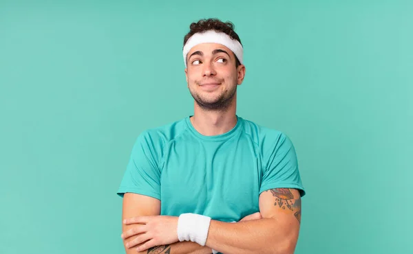 Fitness Man Shrugging Feeling Confused Uncertain Doubting Arms Crossed Puzzled — Stock Photo, Image