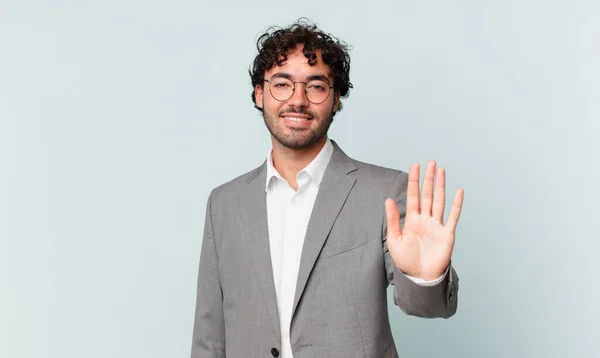 Hispanic Businessman Smiling Happily Cheerfully Waving Hand Welcoming Greeting You — Foto Stock