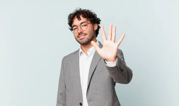 Hispanic Businessman Smiling Looking Friendly Showing Number Five Fifth Hand — Zdjęcie stockowe