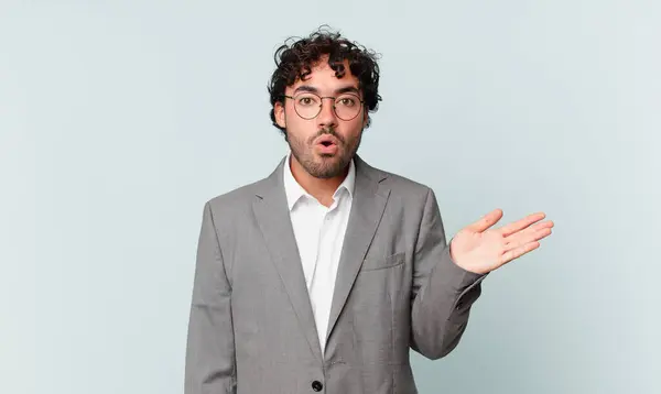 Hispanic Businessman Looking Surprised Shocked Jaw Dropped Holding Object Open — Foto Stock