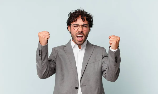 Hispanic Businessman Shouting Aggressively Angry Expression Fists Clenched Celebrating Success — Stockfoto