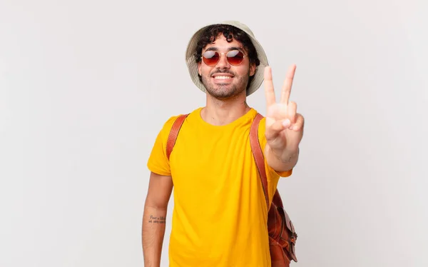 Hispanic Tourist Man Smiling Looking Happy Carefree Positive Gesturing Victory — Stock Photo, Image
