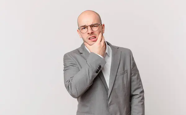 Bald Businessman Mouth Eyes Wide Open Hand Chin Feeling Unpleasantly — Stock Photo, Image