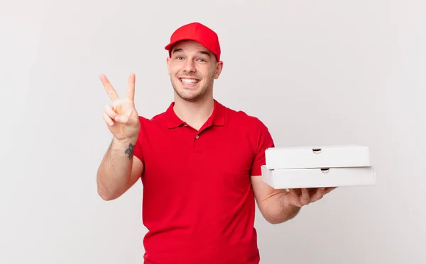 Pizza Deliver Man Smiling Looking Happy Carefree Positive Gesturing Victory — Stock Photo, Image