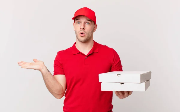 Pizza Deliver Man Looking Surprised Shocked Jaw Dropped Holding Object — Stock Photo, Image