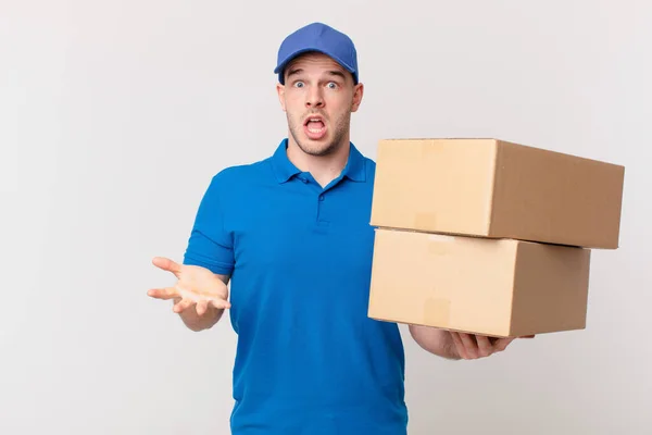 Package Deliver Man Feeling Extremely Shocked Surprised Anxious Panicking Stressed — Stock Photo, Image