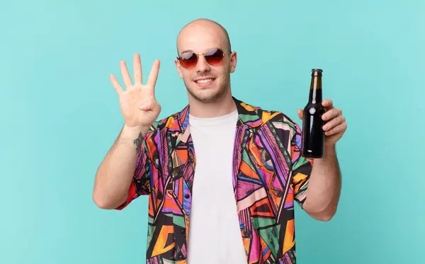 tourist with beer tourist man smiling and looking friendly, showing number four or fourth with hand forward, counting down