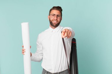 Genç ve yakışıklı bir adam kamerayı işaret ederek seni seçiyor. mimar konsepti