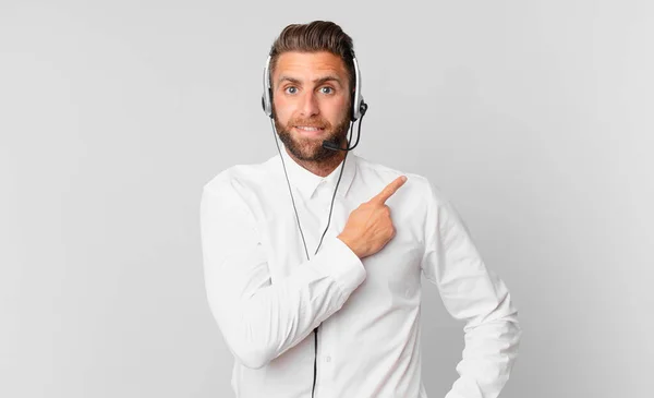 Young Handsome Man Smiling Cheerfully Feeling Happy Pointing Side Telemarketing — Photo