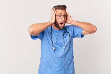 young handsome man feeling happy, excited and surprised. nurse concept