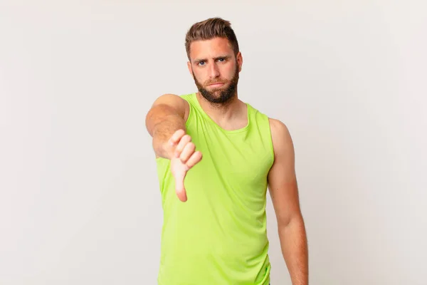 Young Handsome Man Feeling Cross Showing Thumbs Fitness Concept — Stockfoto