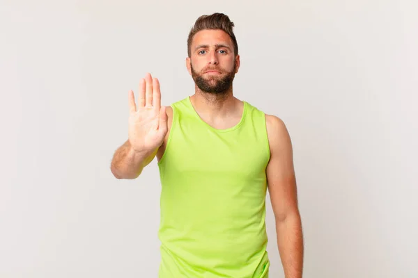 Young Handsome Man Looking Serious Showing Open Palm Making Stop — Stockfoto