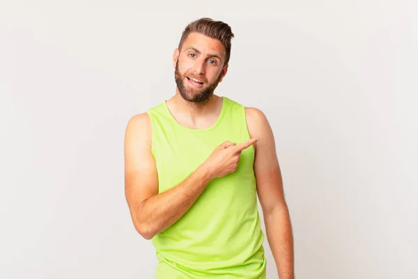 Young Handsome Man Looking Excited Surprised Pointing Side Fitness Concept — Stockfoto